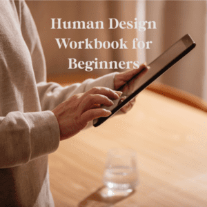 Human Design Workbook text across a background of a woman using a tablet